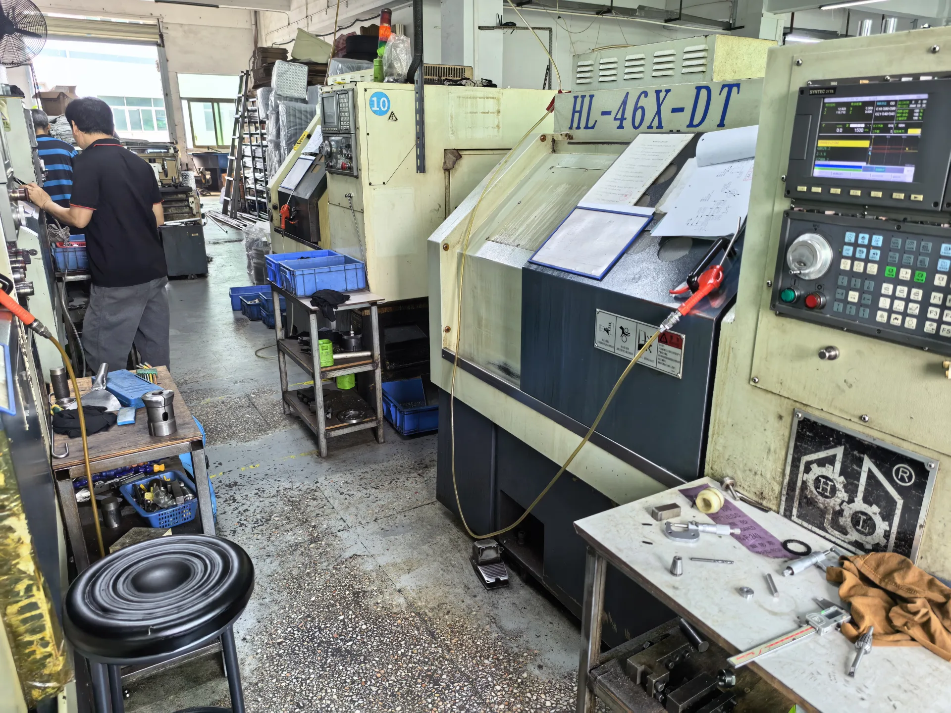 CNC turning machines and operators on production floor